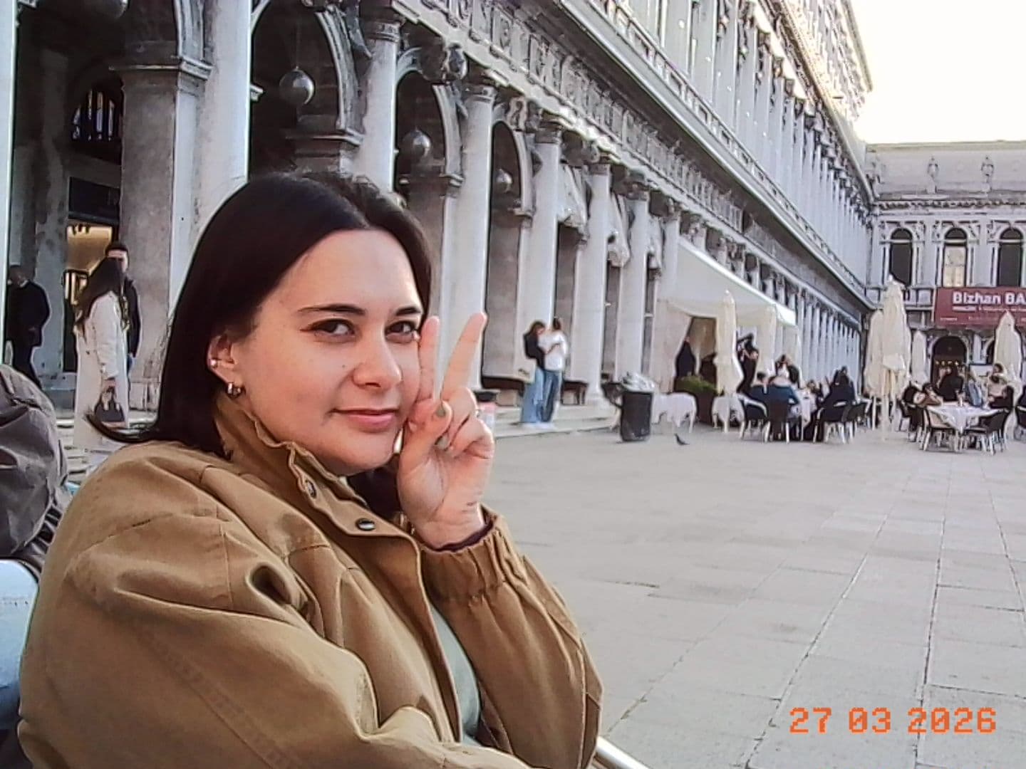 Jacqui posing at the Procuratie colonnade in St. Mark's Square
