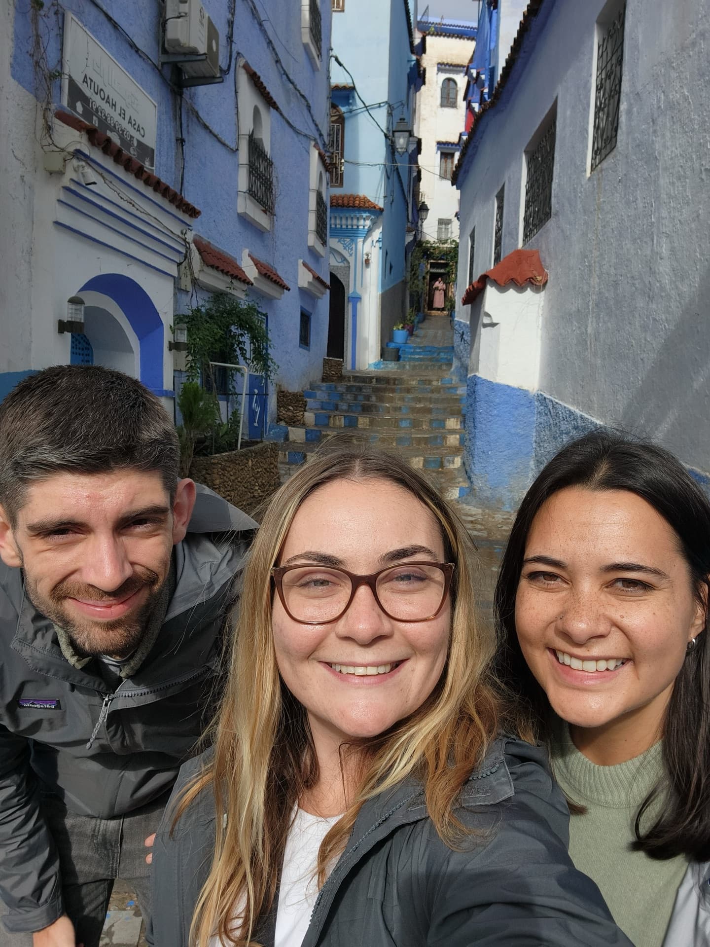 The three of us taking a selfie in a blue alleyway in Chefchaouen